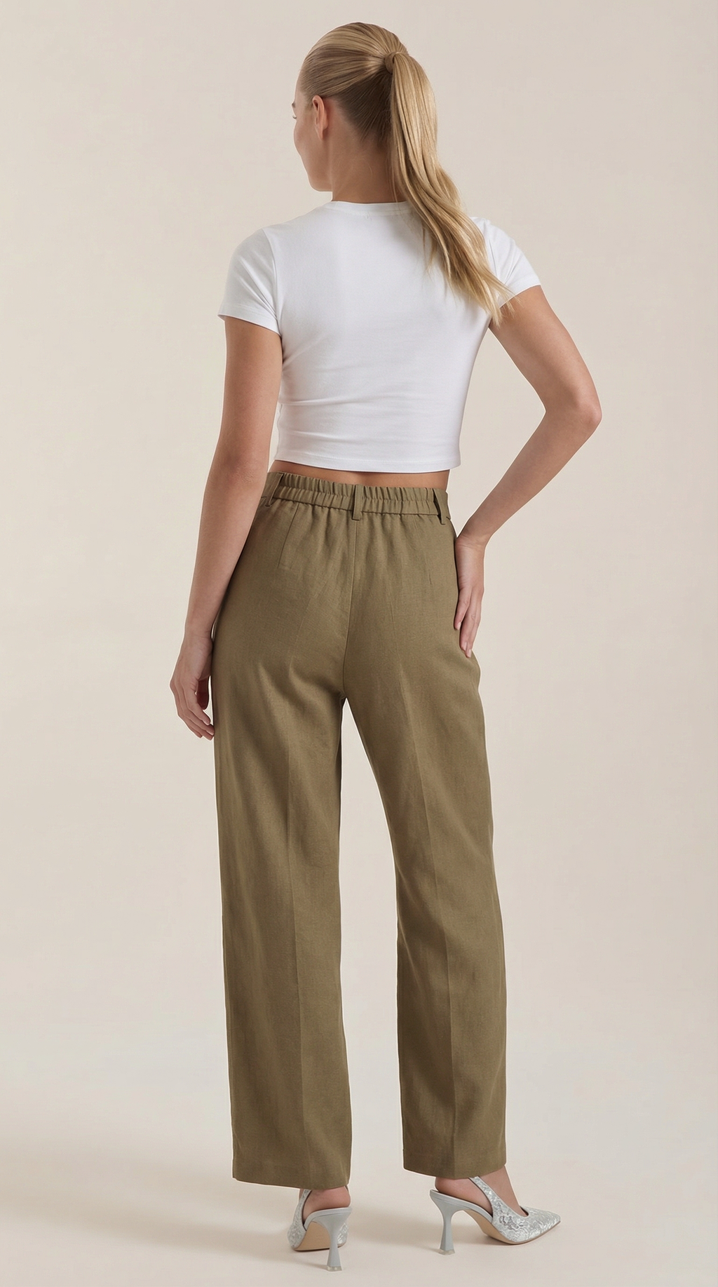Dark green high-rise pleated wide-leg pants with gathered waistband