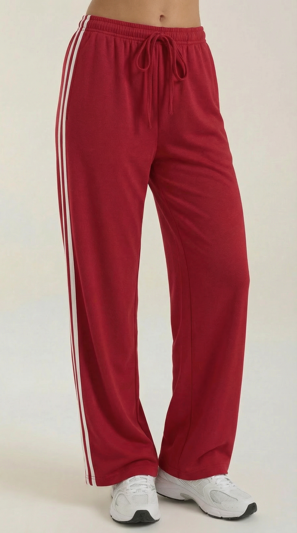 Burgundy wide-leg track pants with white side stripes and drawstring waist