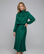 Dark green satin cowl neck midi dress with long sleeves and gathered waist