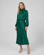 Dark green satin cowl neck midi dress with long sleeves, fitted bodice