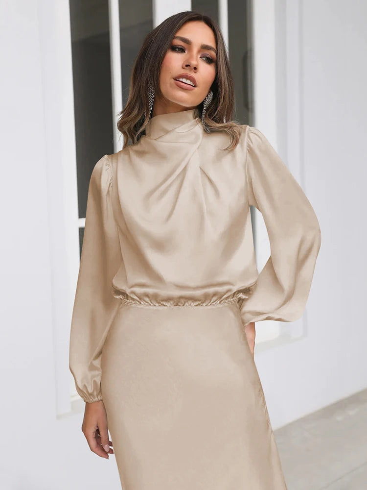 Beige satin cowl neck midi dress with long sleeves and gathered waist