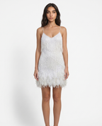 Women's white sequin mini dress with spaghetti straps and feather fringe hem