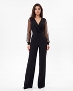 Black V-neck wide-leg jumpsuit with sheer dotted sleeves