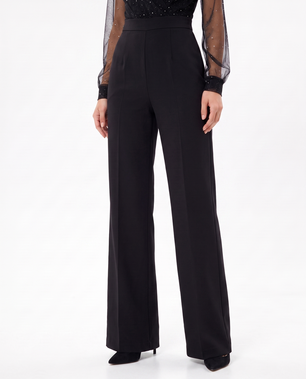Black wide-leg jumpsuit with tailored waist and sheer dotted cuffs
