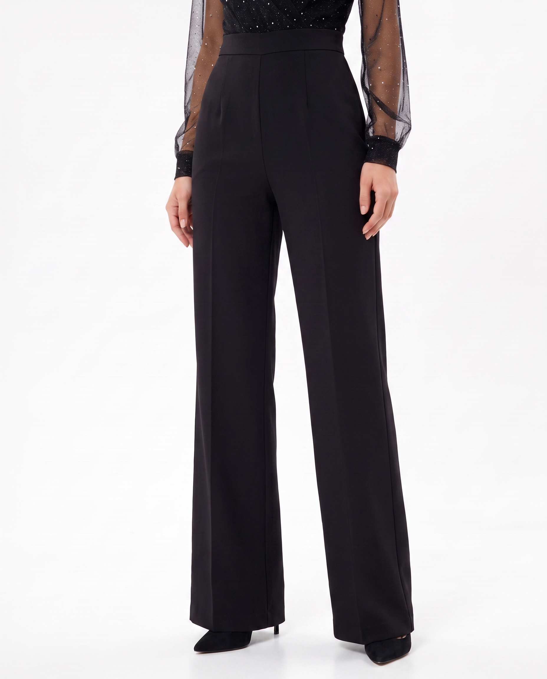 Black wide-leg jumpsuit with tailored waist and sheer dotted cuffs