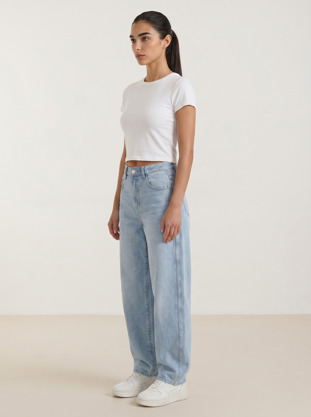 Light blue wide-leg jeans with high-rise waist and button-front closure
