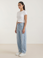 Light blue wide-leg jeans with high-rise waist and button-front closure