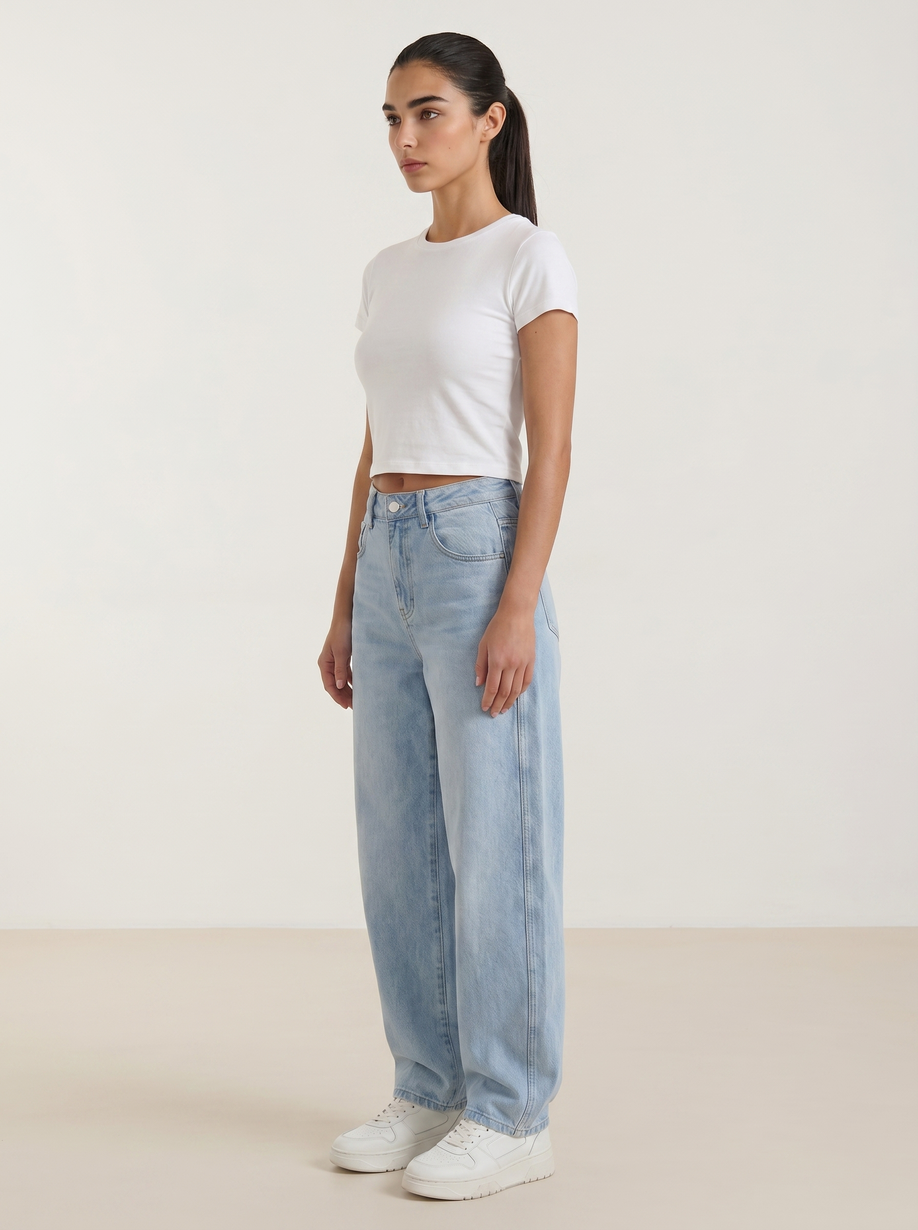 Light blue wide-leg jeans with high-rise waist and button-front closure