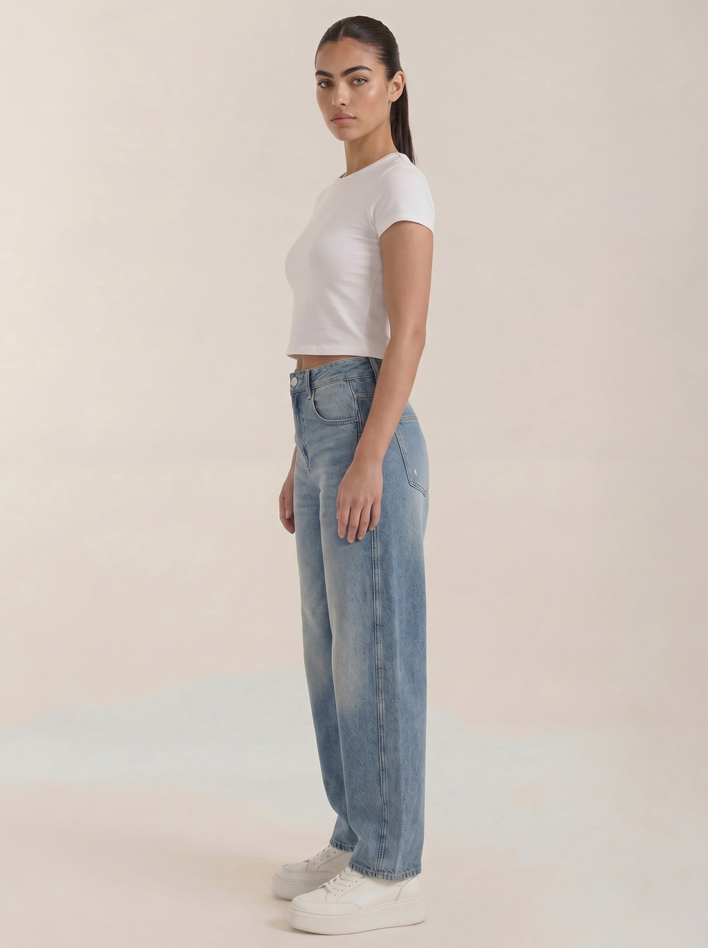 Light blue wide-leg jeans, side view with belt loops and button closure