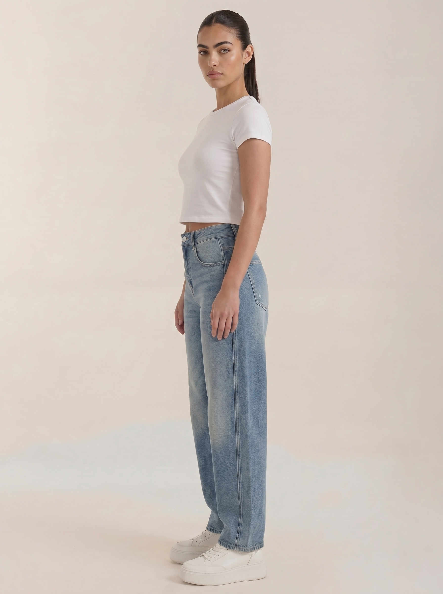 Light blue wide-leg jeans, side view with belt loops and button closure