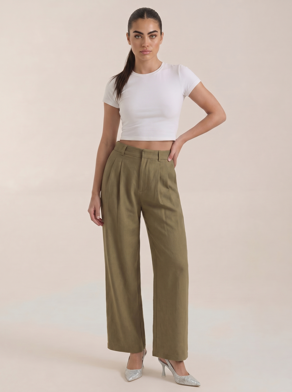 Women’s high-rise pleated wide-leg pants in dark green, full length, zip front.