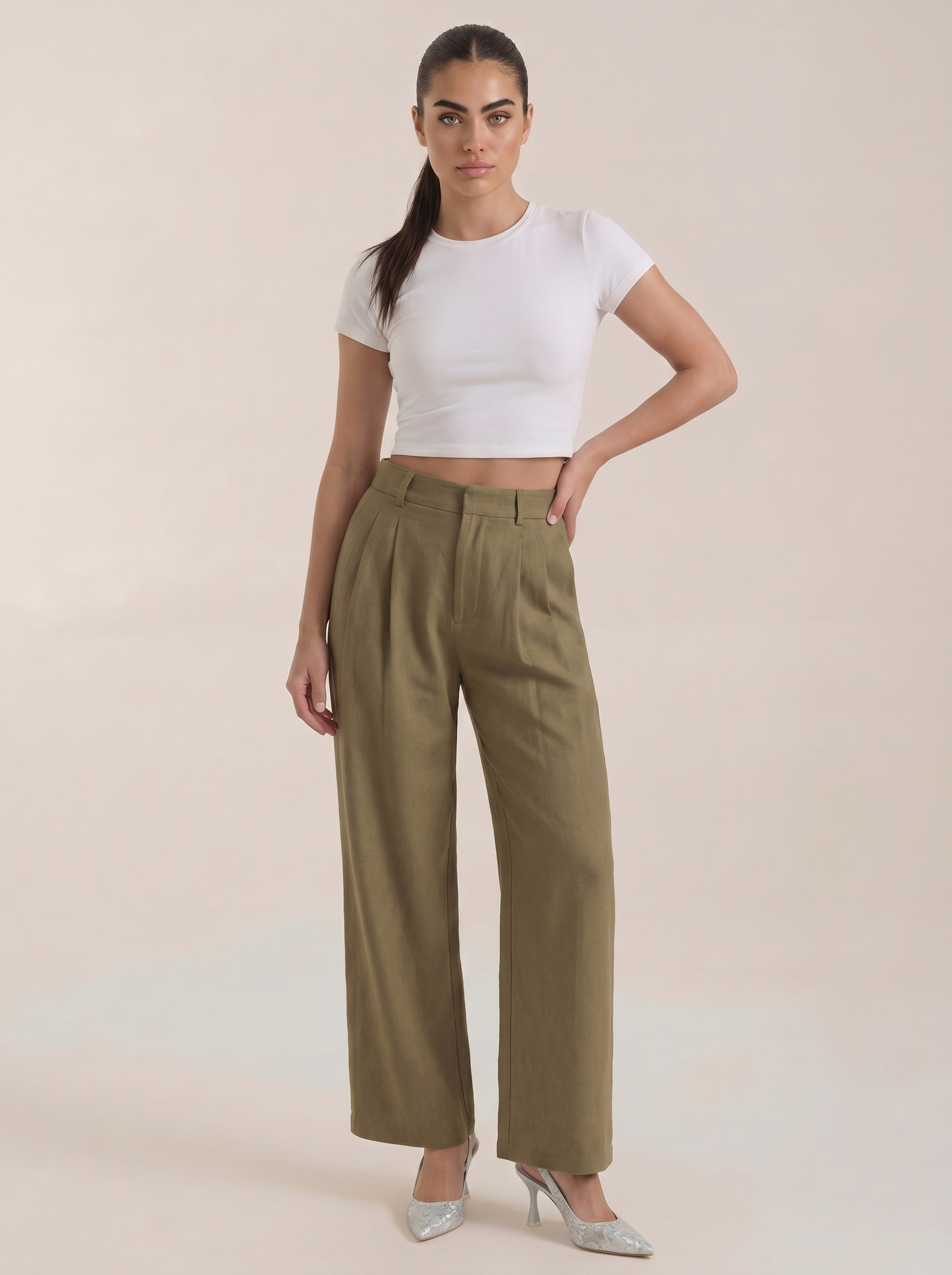 Women’s high-rise pleated wide-leg pants in dark green, full length, zip front.
