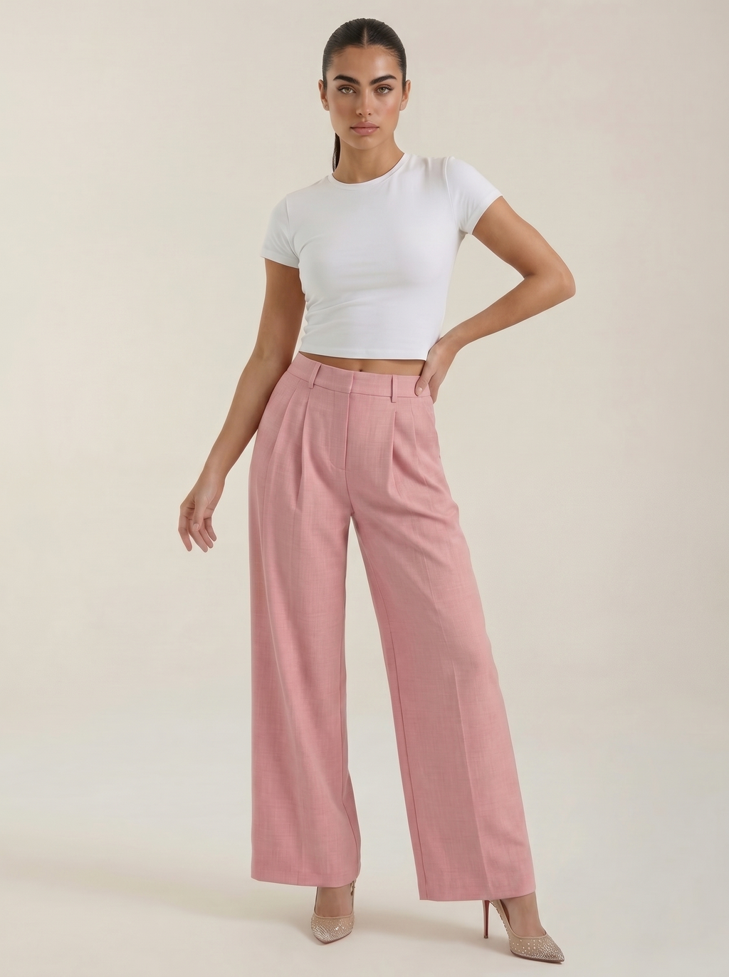 Women’s high-rise pleated wide-leg pants in pink, full length, zip front.