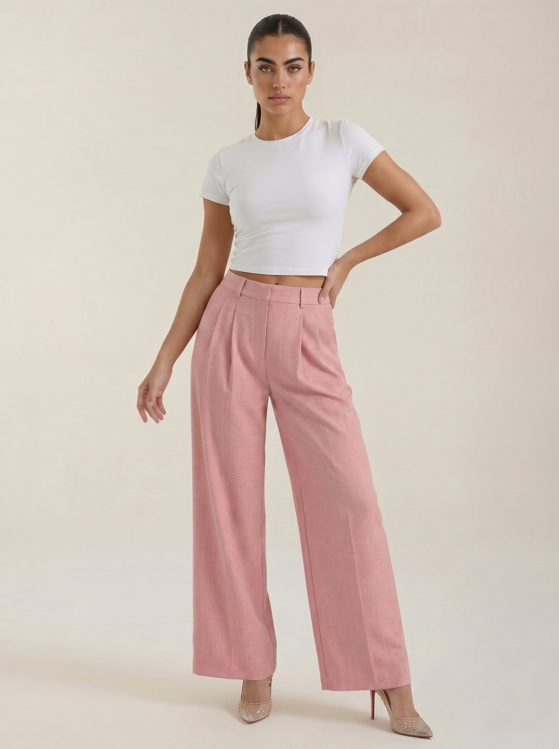 Women’s high-rise pleated wide-leg pants in pink, full length, zip front.