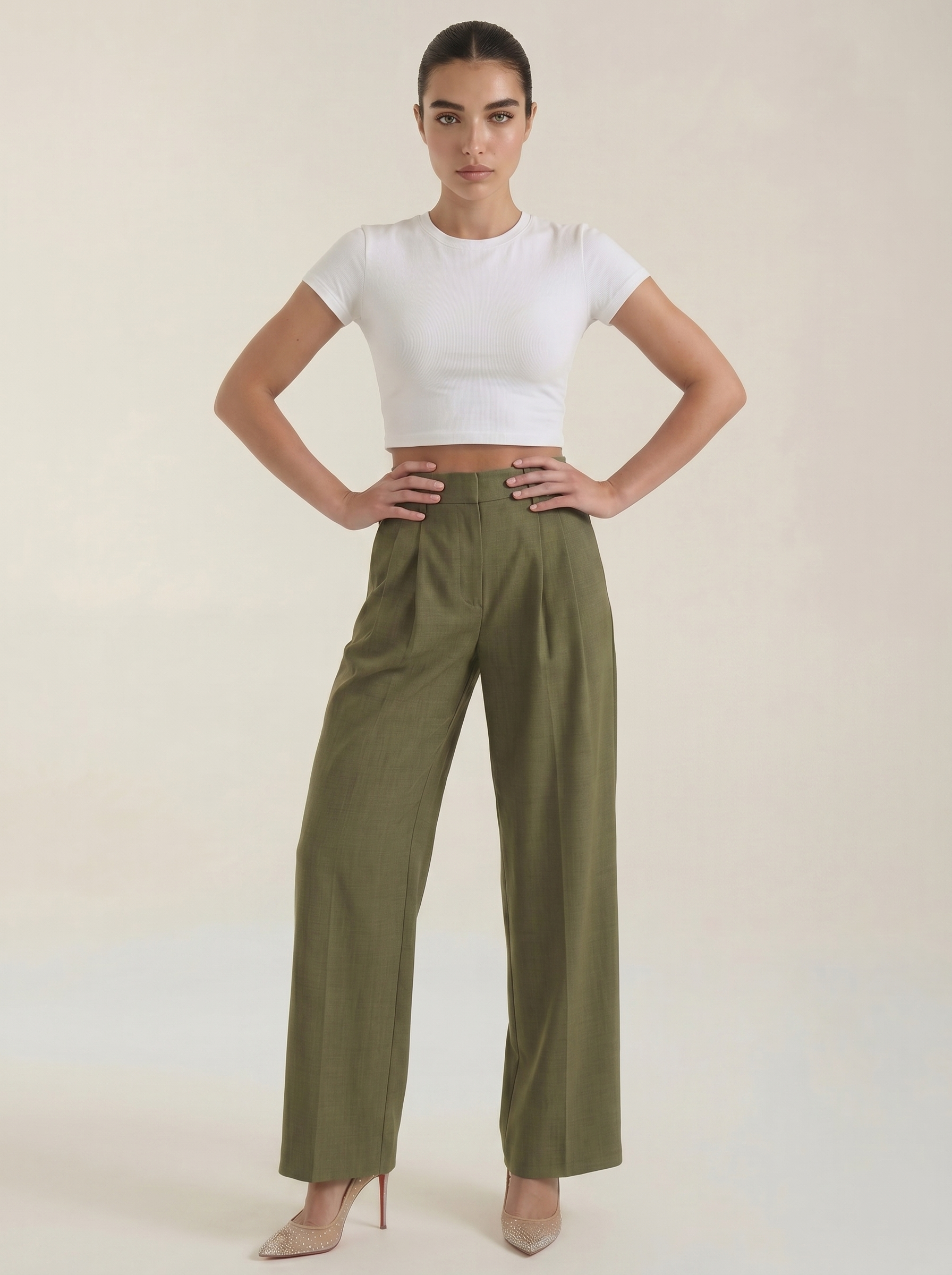 Women’s dark green high-rise pleated wide-leg pants, front view with seam details.