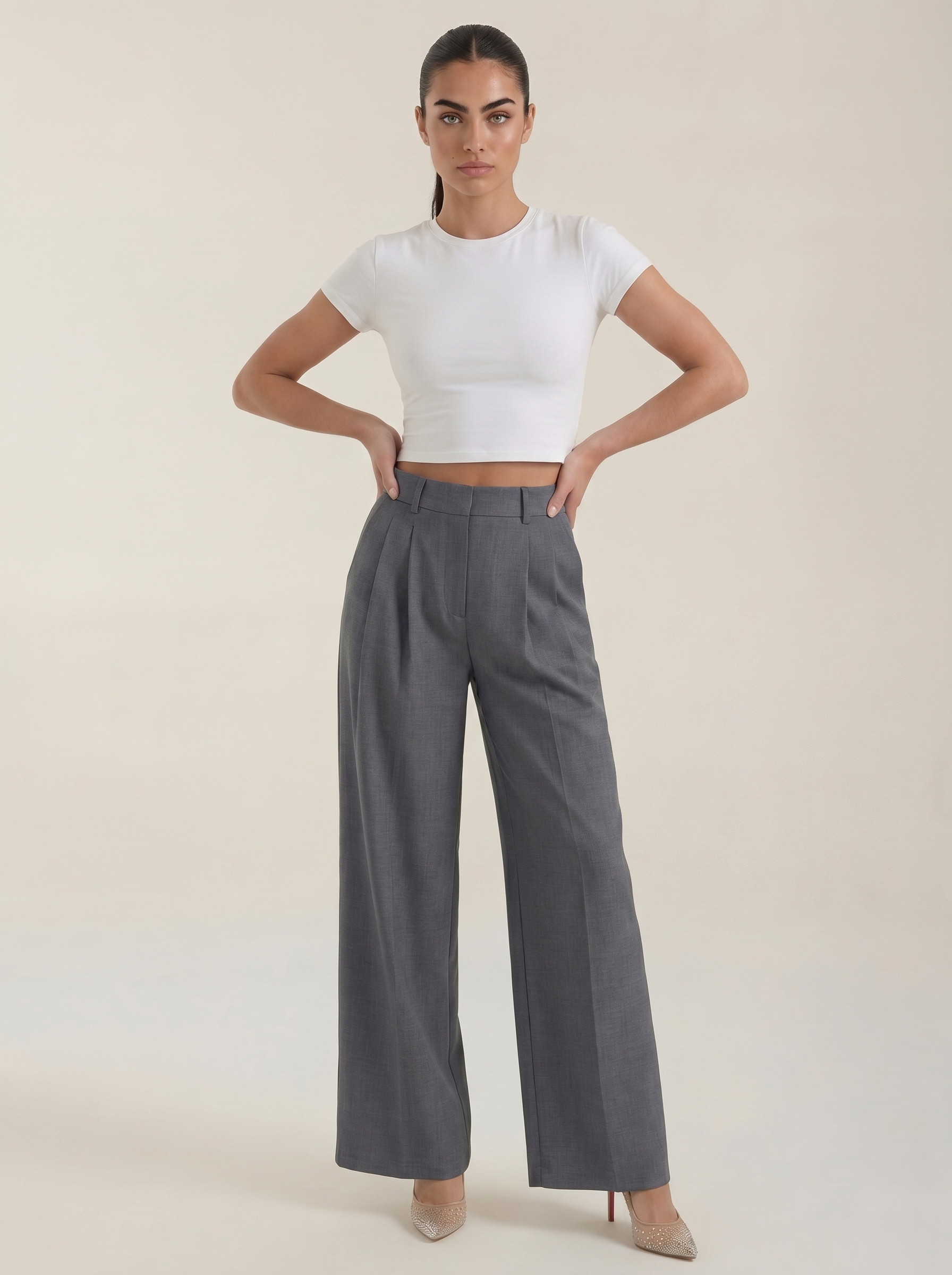 Women’s high-rise pleated wide-leg pants in gray, full length, zip front.