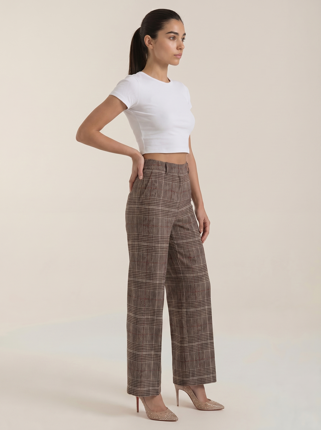Women's brown plaid high-waisted wide-leg trousers, side view, ankle-length