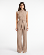 Women’s beige sleeveless wide-leg jumpsuit with stand collar and belt-tie at waist